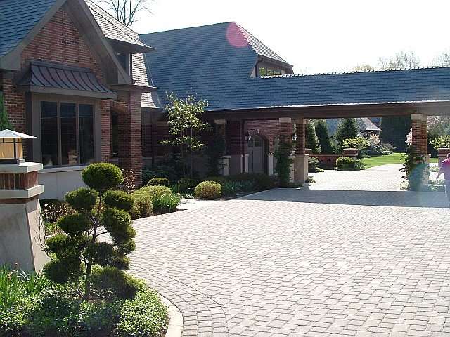 View of brickwork motorcourt at Cleveland residence, Landscape Design by Douglas Nemeckay & Associates. .